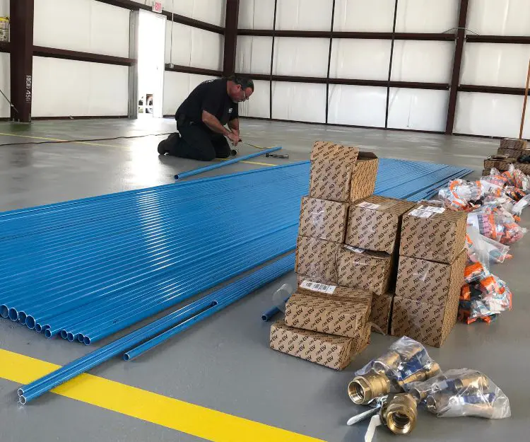 ACAS service team installing AST TruLink Piping System for Air Compressors